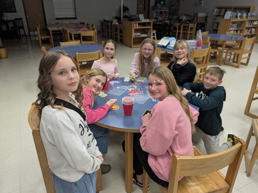 Students making crafts in the library.