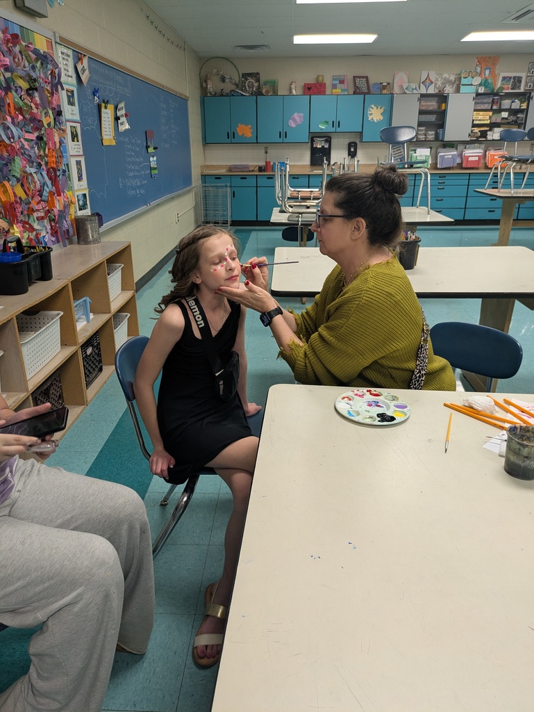 Student getting their face painted.  