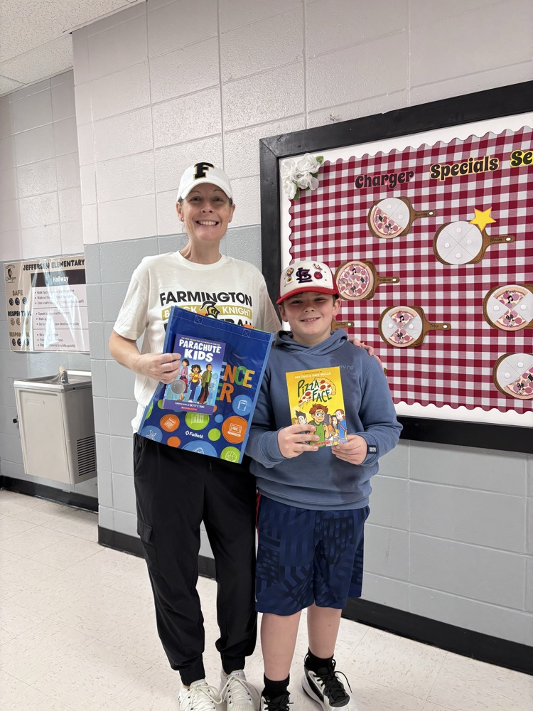 kid and teacher with books