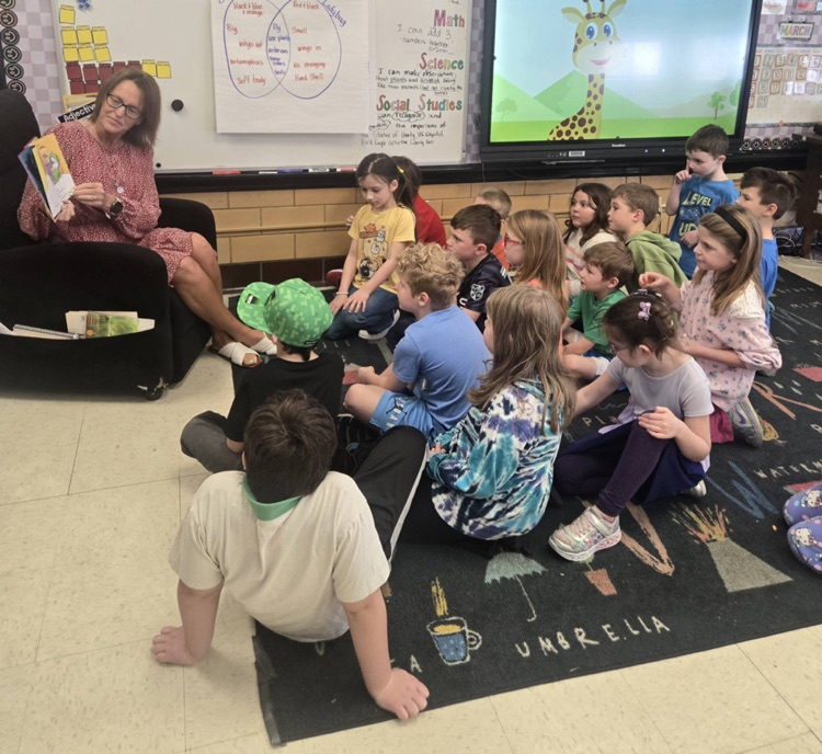 guest teacher reading to first grade students 