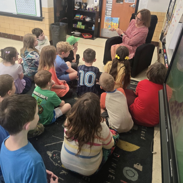 guest teacher reading to first grade students 