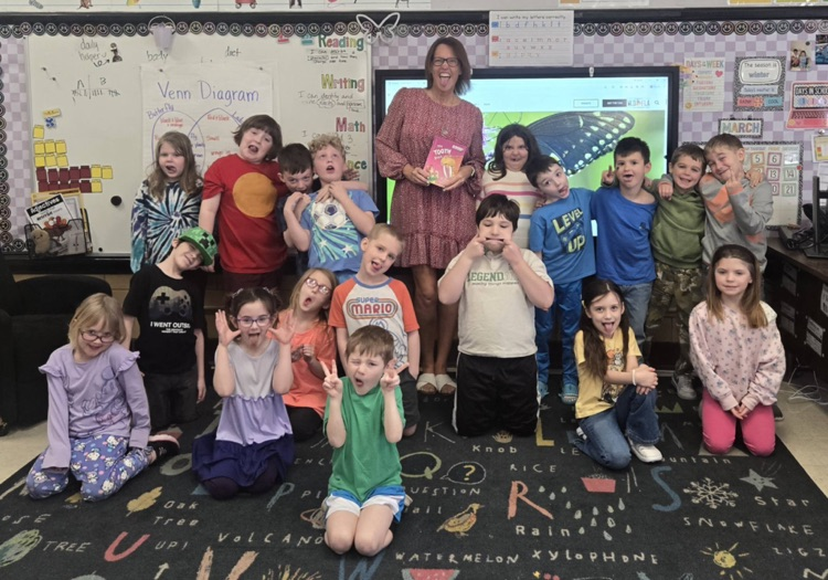 guest teacher reading to first grade students 