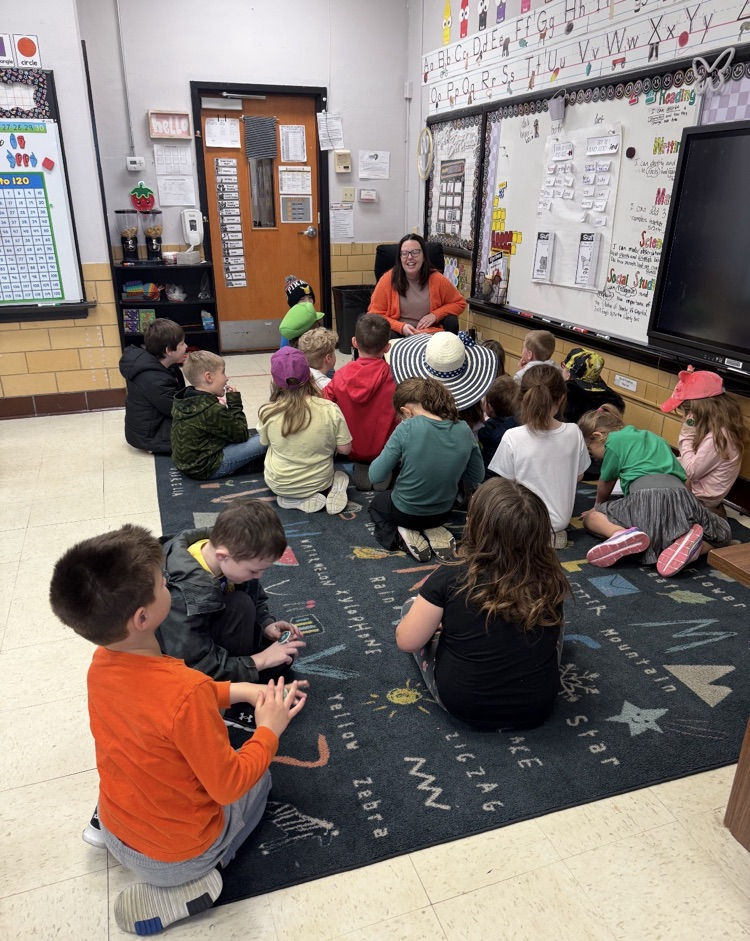 guest teacher reading to first grade students 