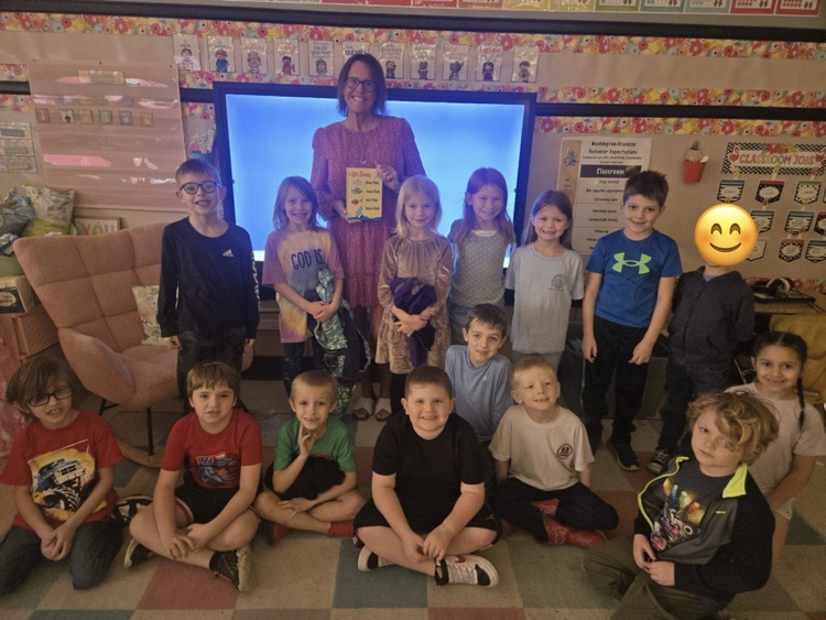 guest teacher reading to first grade students 