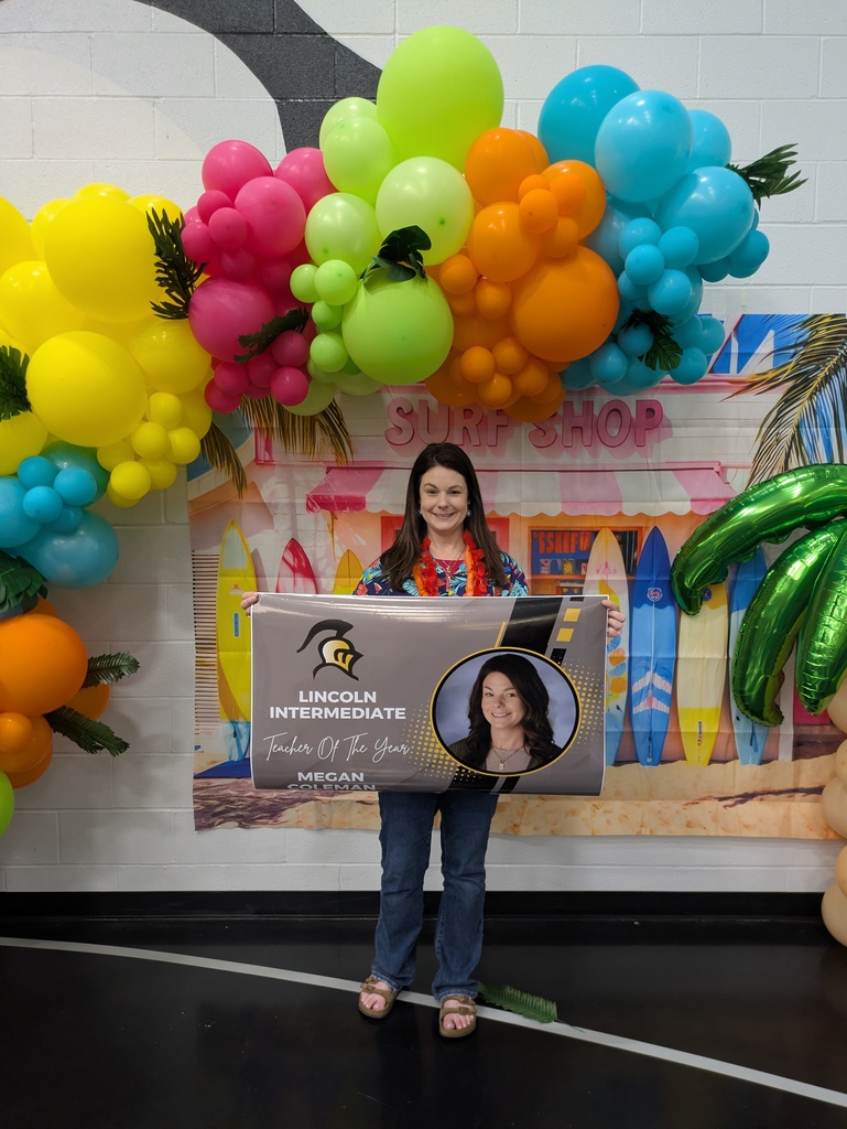 A portrait of Mrs. Coleman, the Lincoln Intermediate Teacher of the Year, smiling warmly.