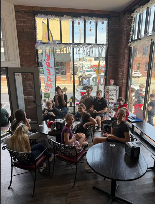 Students inside Mercantile eating ice cream.