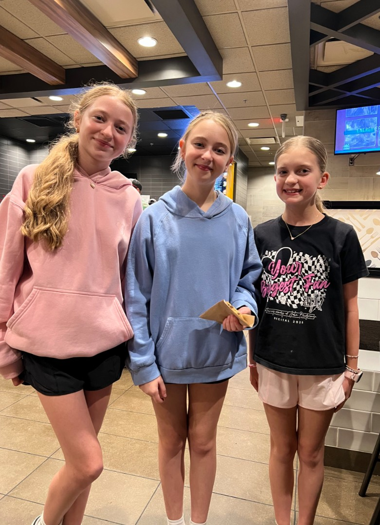 Students smiling and helping at Mc Donald's Night.