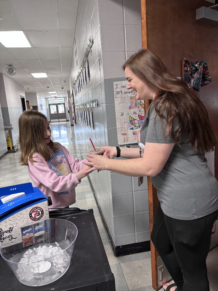 student serving coffee