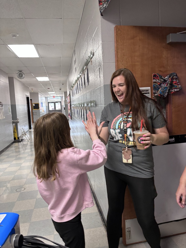 student serving coffee