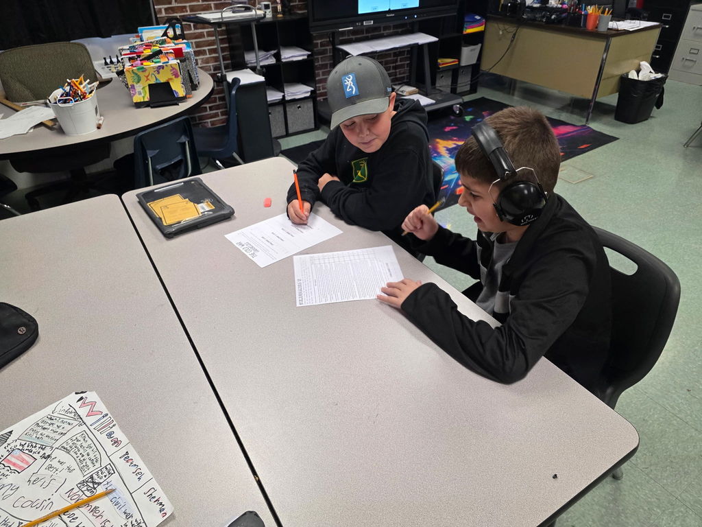 Students working in groups to complete an escape room activity. 