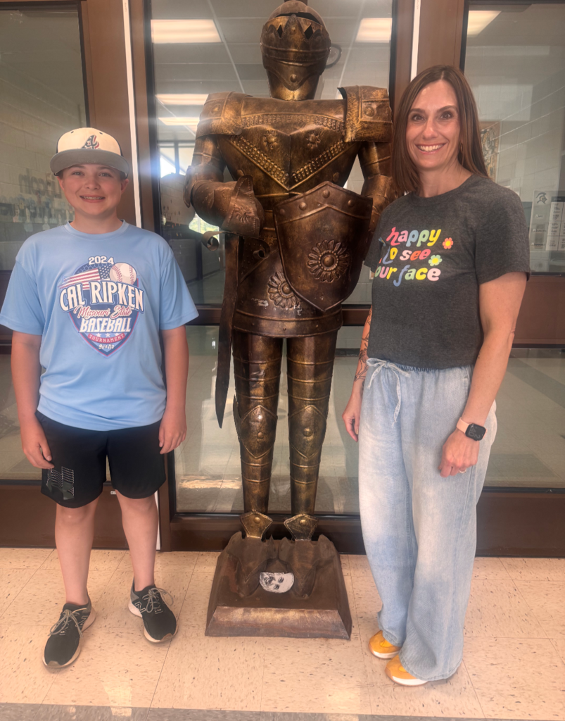 Student of the Month posing for a picture with the assistant principal.