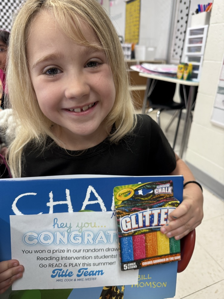 student with book and prize