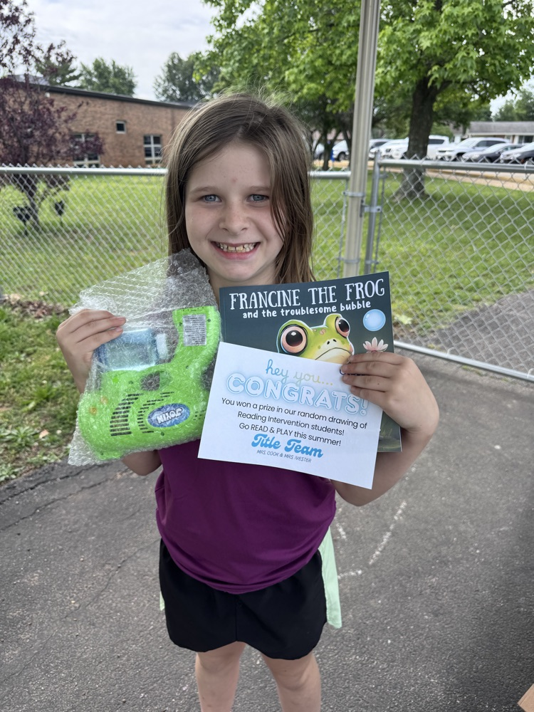 student with book and prize