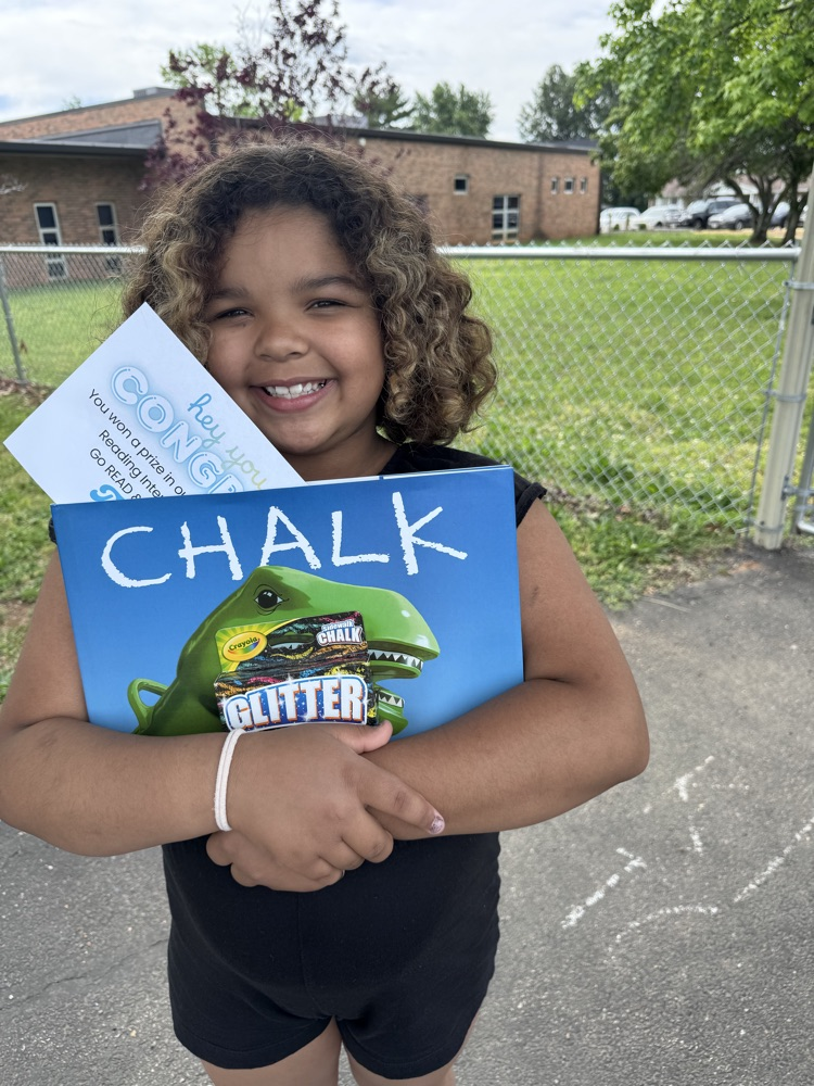 student with book and prize