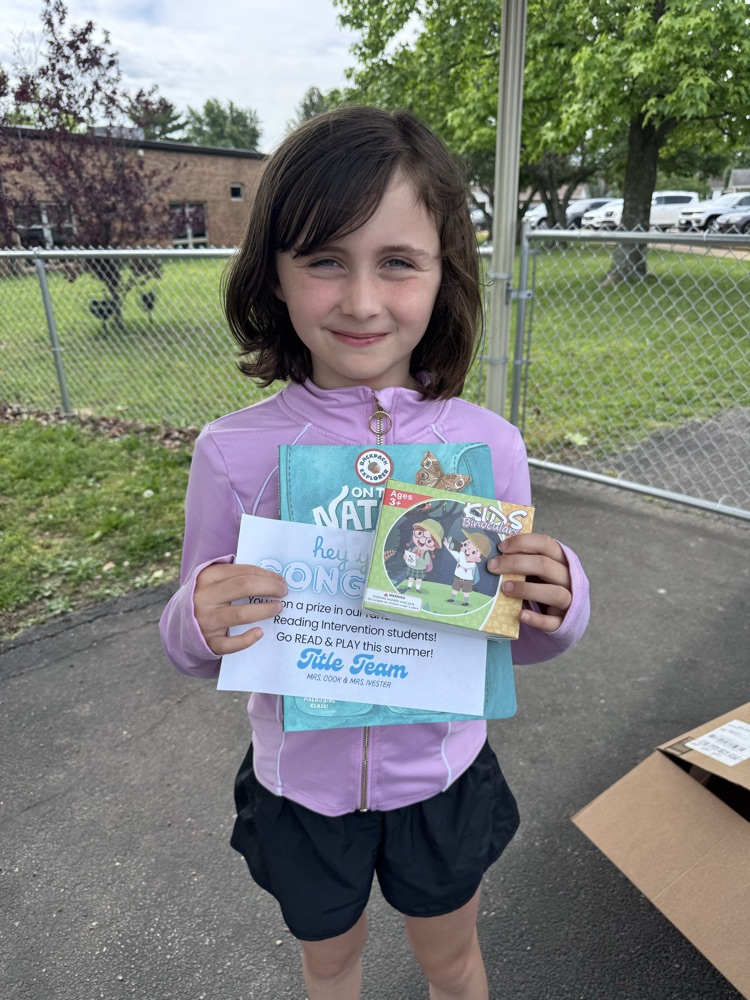 student with book and prize