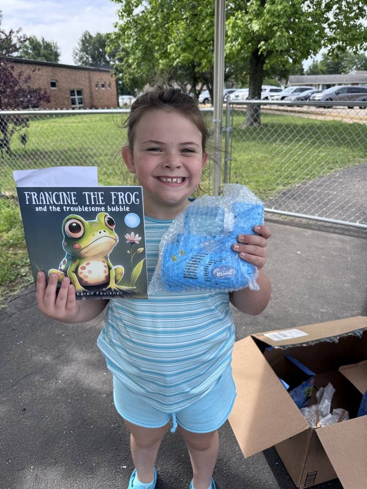 student with book and prize