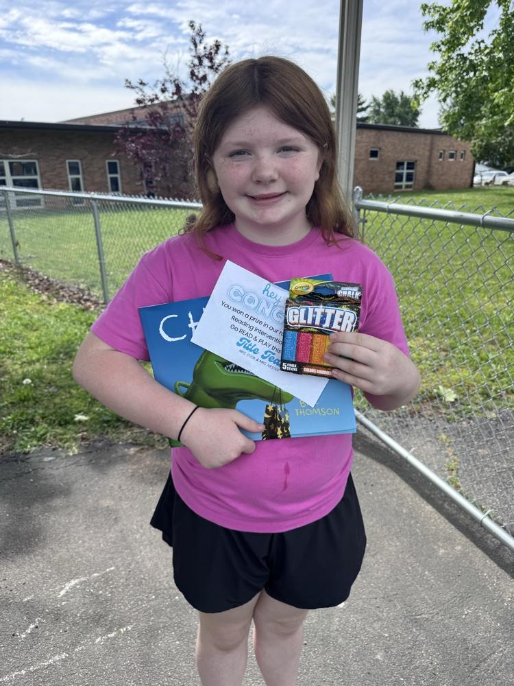 student with book and prize
