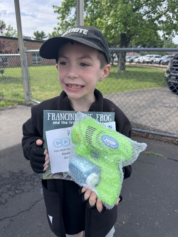 student with book and prize