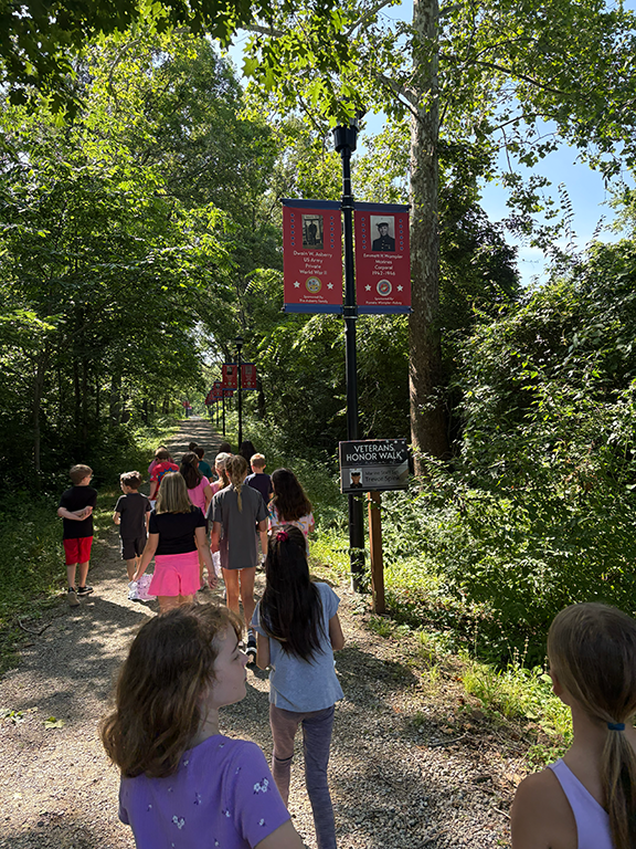 Kids walking on a Veterans Honor walk