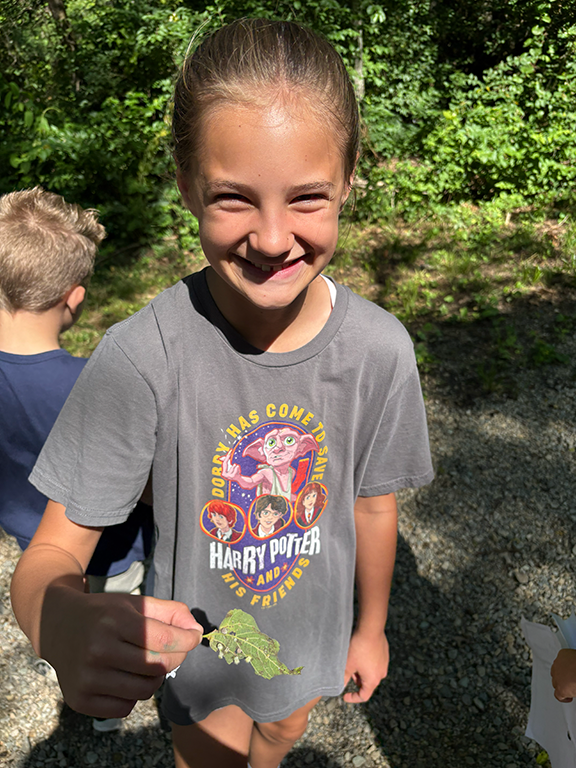 Girl holding leaf