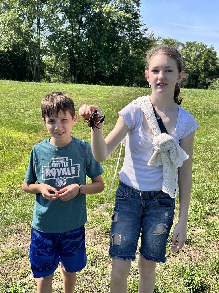 Girl holding a crawdad