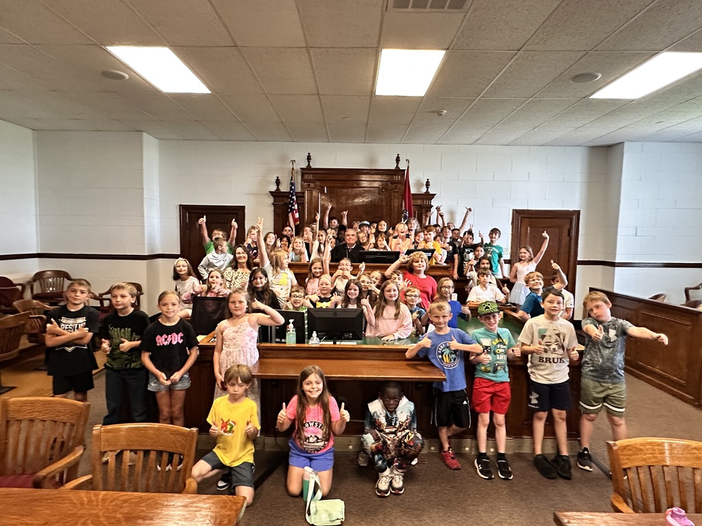 Kids with judge in courthouse