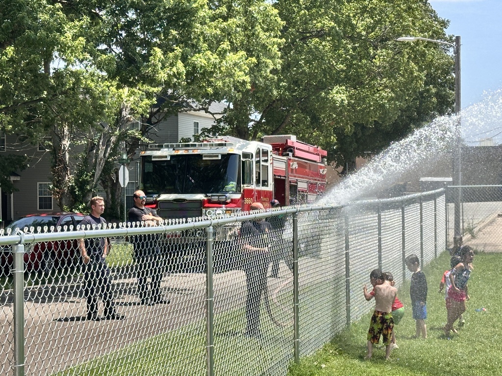 Kids getting sprayed by water