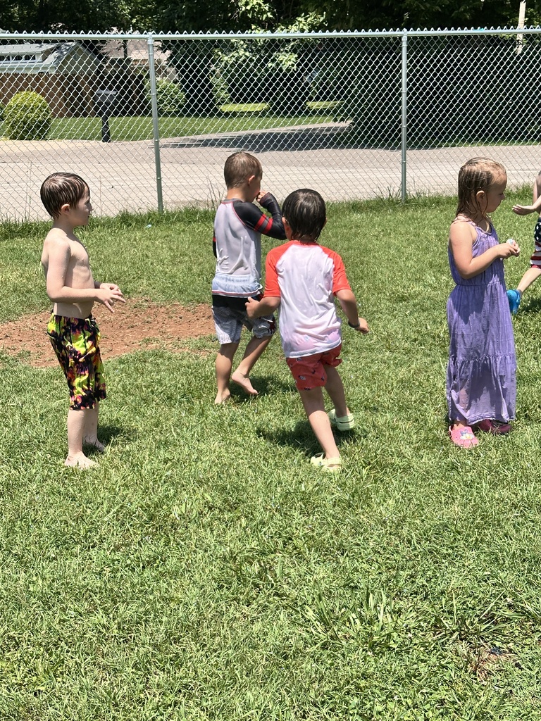 Kids getting sprayed by water