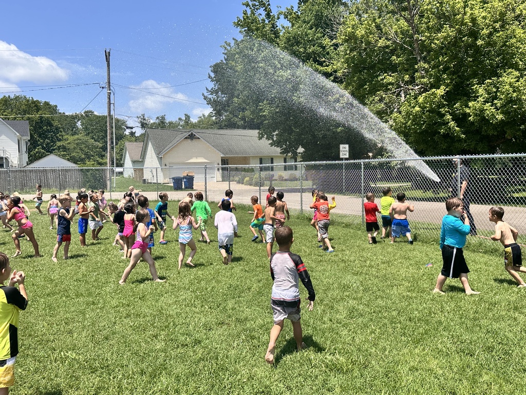 Kids getting sprayed by water