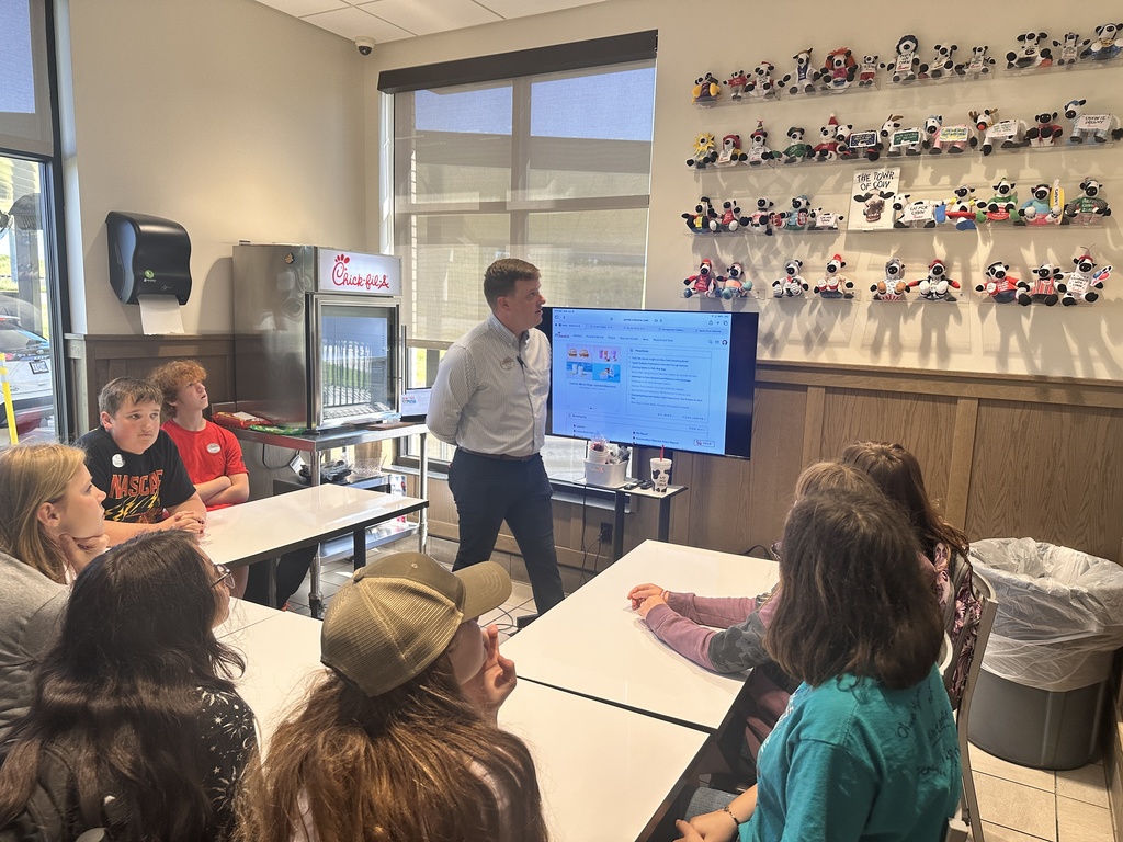 Guy giving presentation to kids