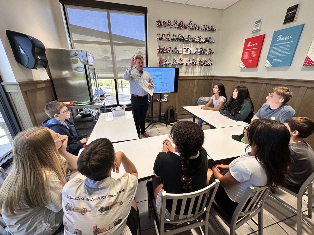 Guy giving presentation to kids