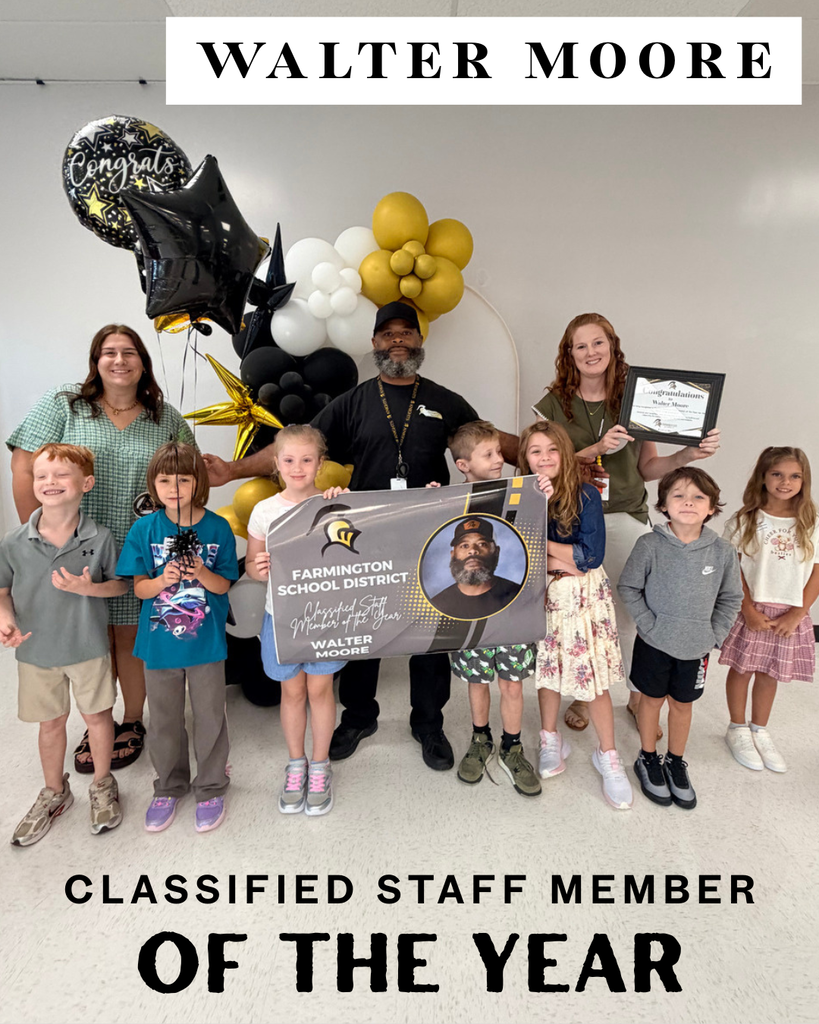 A group of people with balloons and a sign. A man stands with a certificate. "Classified Staff Member of the Year" is written above.