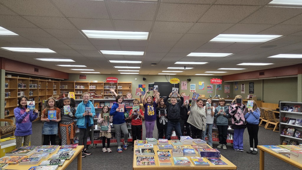happy cheering children from getting books at book fair