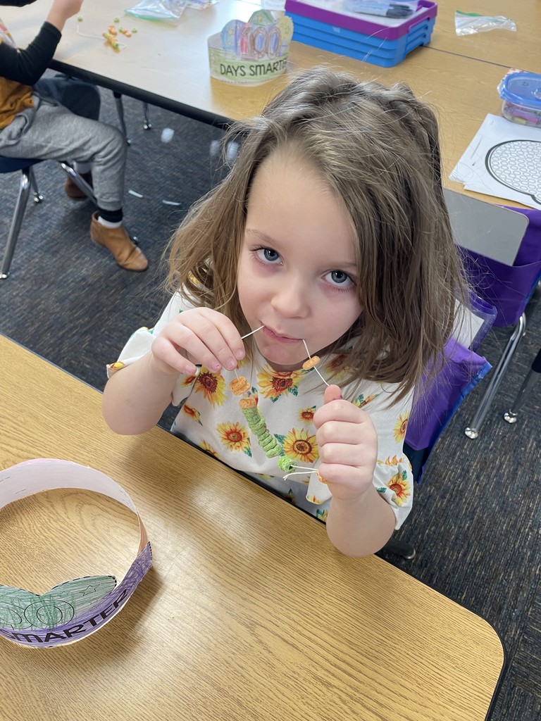 student enjoying candy necklace