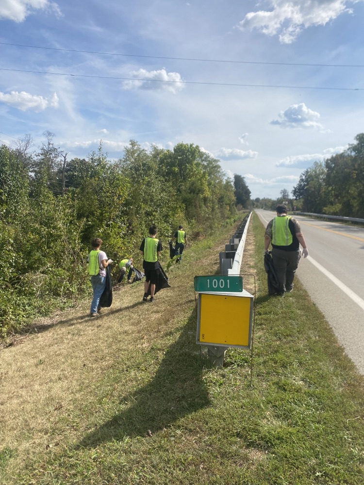 Members picking up trash and recyclables