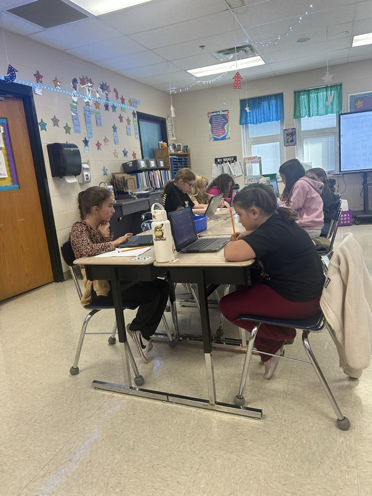 Students working hard in 4th grade on their project!