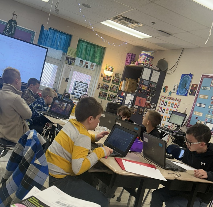 Students working hard in 4th grade on their project!