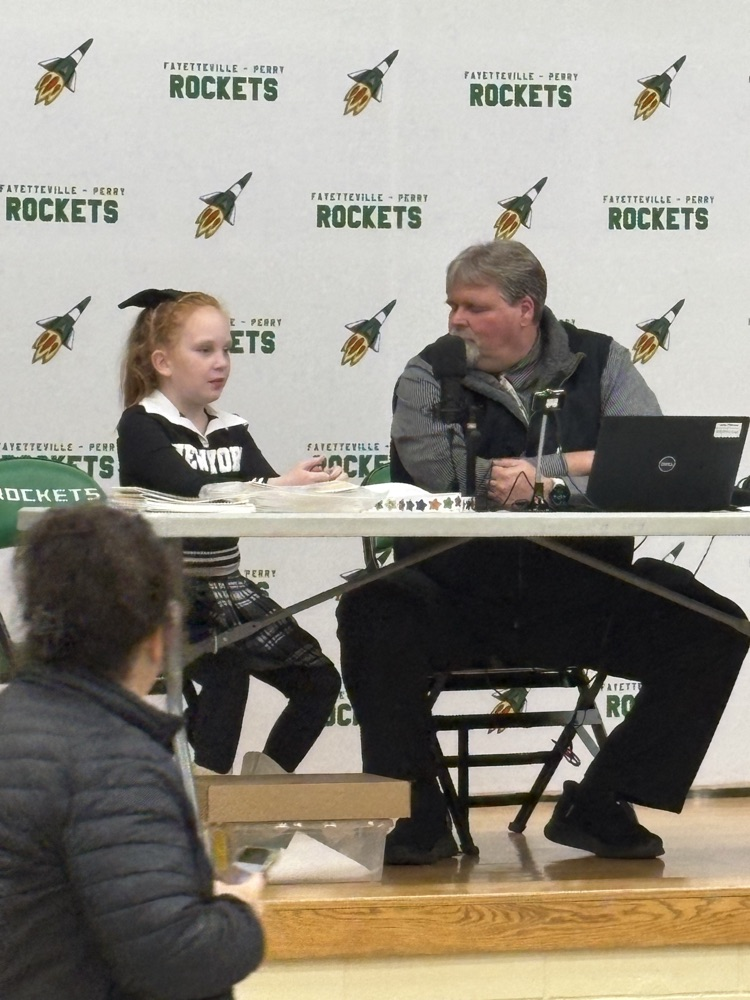 Mr. Fiscus interviewing a student