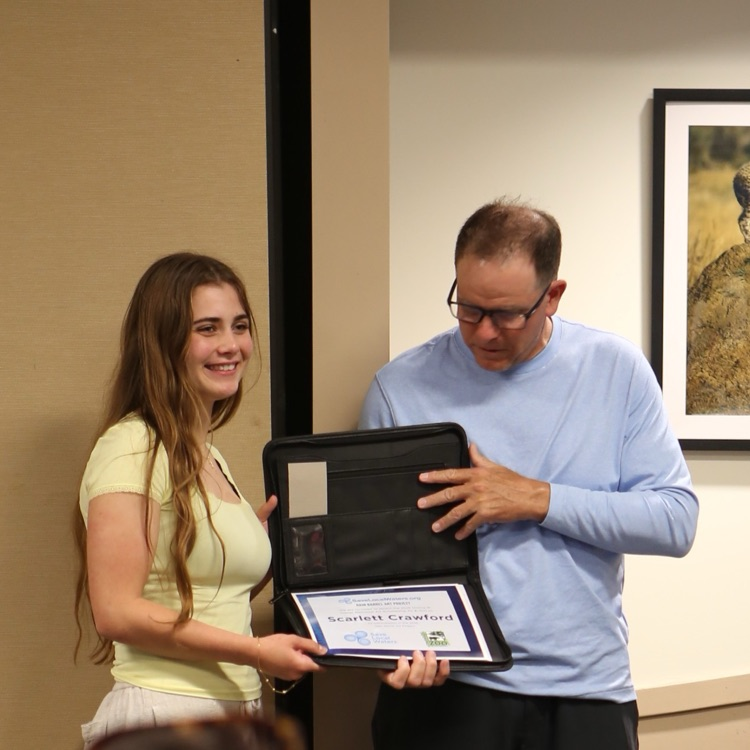 Scarlett Crawford receiving her scholarship