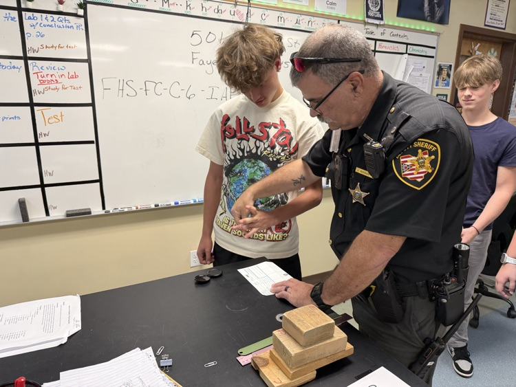 SRO Noonan teaching how to do fingerprinting