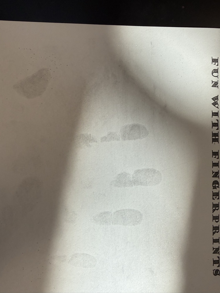 latent print of hand found on paper