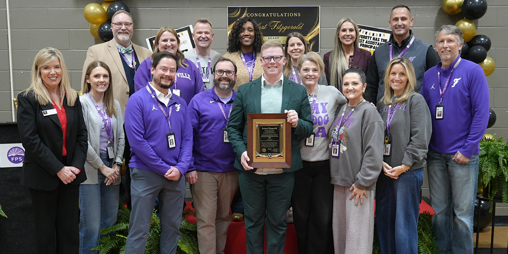 Our very own Mr. Robert Fitzgerald was surprised today with the the Arkansas Association of Elementary School Principals Assistant Principal of the Year award at Leverett Elementary! The secret was successfully kept, and “Mr. Fitz” was honored during a special assembly surrounded by students, staff, administrators, and family. It was a well-deserved moment of recognition for an outstanding leader who makes a difference every day! Congratulations, Mr. Fitz! We are so proud of you! 💜