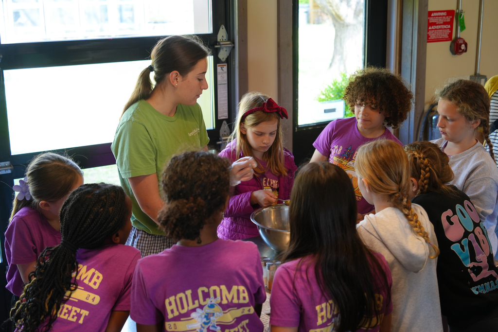 Holcomb 4th grade students work on the Apple Seeds farm picking fresh vegetables and preparing them to eat.