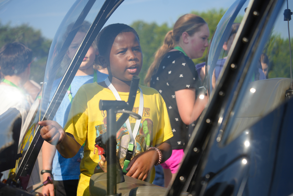 Holt Middle School science students experienced an unforgettable lesson on energy today! Airo (Arkansas Helicopters) pilots landed a helicopter right on campus and students were able to explore it up close. 