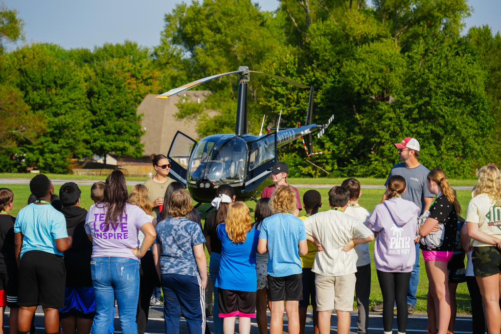 Holt Middle School science students experienced an unforgettable lesson on energy today! Airo (Arkansas Helicopters) pilots landed a helicopter right on campus and students were able to explore it up close. 