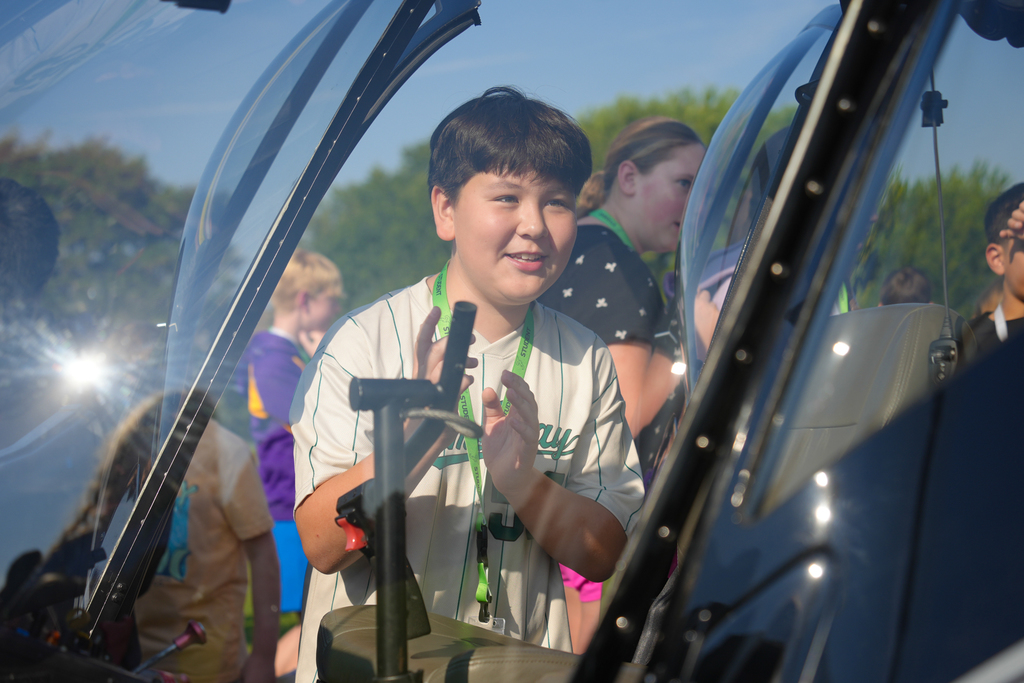 Holt Middle School science students experienced an unforgettable lesson on energy today! Airo (Arkansas Helicopters) pilots landed a helicopter right on campus and students were able to explore it up close. 