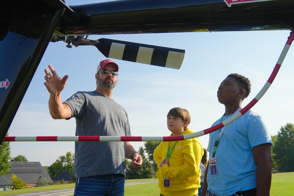 Holt Middle School science students experienced an unforgettable lesson on energy today! Airo (Arkansas Helicopters) pilots landed a helicopter right on campus and students were able to explore it up close. 
