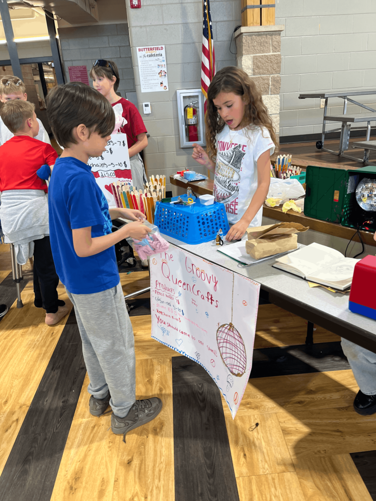 Student shopping at a product booth