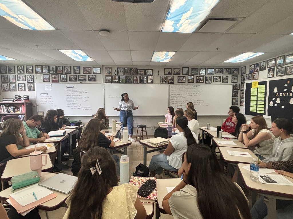 Students listening to a presentation.