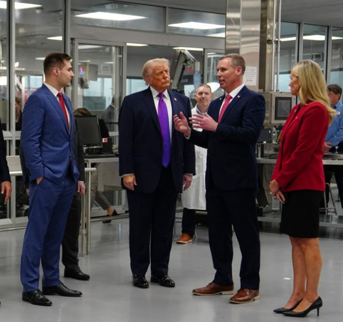 President Donald Trump and Centers for Medicare & Medicaid Services administrator Dr. Mehmet Oz, left, listen, during a tour at Thermo Fisher Scientific, Wednesday, March 11, 2026, in Cincinnati. At right is Amanda Bosse, president of clinical trials at Thermo Fisher Scientific.